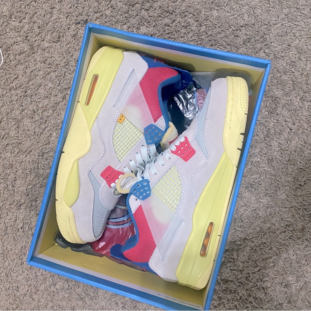 Size 11 Jordan 4 Guava ice.